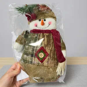 Christmas plush snowman doll with red plaid hat and scarf in transparent packaging