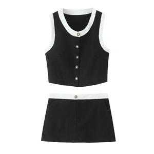 Close-up of contrast trim sleeveless vest and mini skirt set with pearl buttons