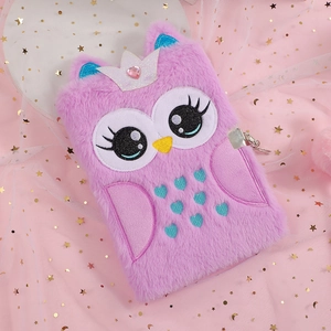 Detail of purple plush owl diary with silver lock, sequin crown and heart embroidery