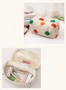 Detailed interior view of plush polka dot makeup bag with mesh compartment and storage space