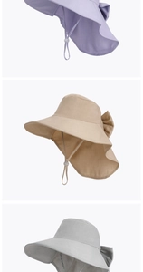 Detailed view of wide brim sun hats with bow decoration and chin straps in three colors