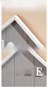 Detail view of the thick solid wood frame and 3D HOME letters on the wall storage hook