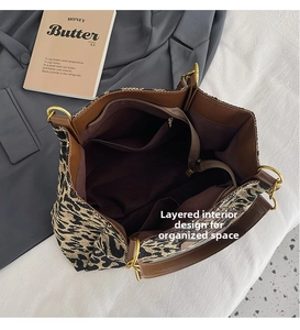 Top view of large leopard canvas tote bag interior showing multi-compartment lining