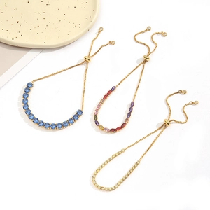 Detailed view of adjustable gold-plated bracelets featuring colorful oval cubic zirconia stones