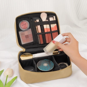 Portable champagne gold PU makeup bag with brush slots and adjustable dividers