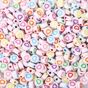 Flat round acrylic beads with colorful heart patterns for DIY jewelry making