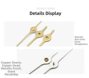Close-up of gold and silver quartz clock hands with smooth finish and copper sleeve