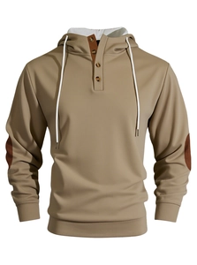 Detail of khaki men's hoodie showing Henley-style button neck and patch material texture