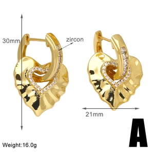 Detailed view of gold heart earrings with zircon stones and dimensions 30mm by 21mm