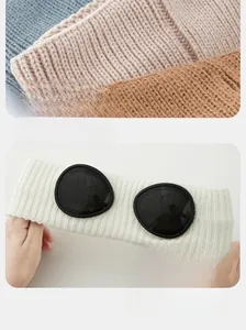 Detail of high-elasticity knitted headband with goggles design in multiple colors