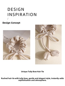 Detailed view of a creamy white satin scrunchie with a unique tulip pendant and ribbon