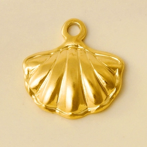 Macro shot of polished gold seashell pendant with detailed 304 stainless steel texture