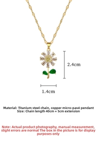 Detail of titanium steel daisy necklace featuring yellow zircon and green enamel leaves