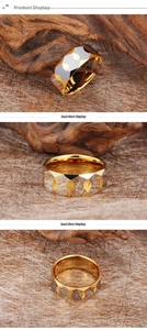 Macro shot of geometric faceted tungsten ring with gold and silver dual-tone finish