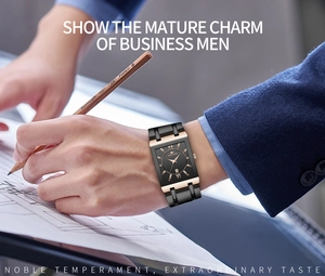 Close-up of men's square business watch with roman numerals and black gold dial detail