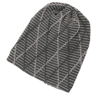 Close-up of winter knit beanie showing grey diamond grid pattern and warm fabric texture