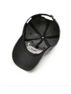 Detail view of washed grey cotton baseball cap interior showing strap and red embroidery