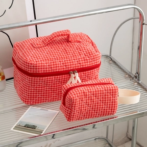 Set of red and white checkered quilted cosmetic bags in large and small sizes