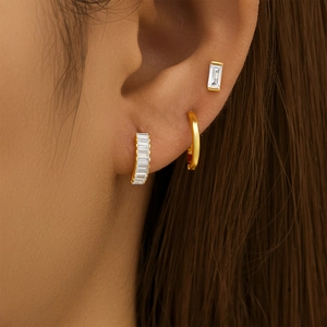 Close-up of S925 sterling silver gold earrings set featuring rectangular zircon stones