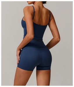 Detail of high-waisted navy blue yoga shorts with ergonomic seams for body shaping
