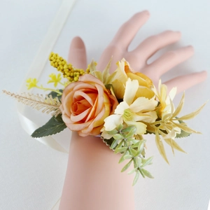 Handmade orange and yellow rose wrist corsage with white ribbon for wedding parties