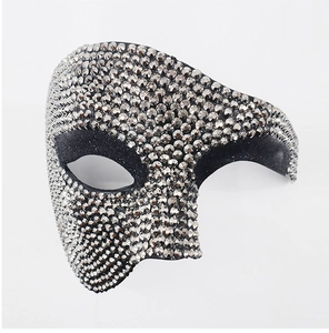 Detail of elegant silver phantom mask with sparkling rhinestones for masquerade parties