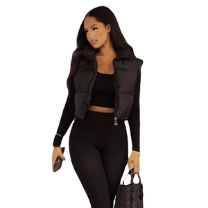 Women's black reversible puffer vest jacket with quilted texture for winter
