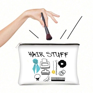 Détail de la trousse à maquillage en toile avec fermeture éclair et motif imprimé Hair Stuff