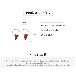 Detailed spec sheet showing amber acrylic heart earrings size 7.5cm with iron materials
