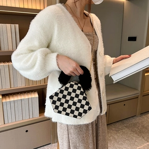 Chic checkered triangle handbag with faux fur handle and chain strap for stylish women