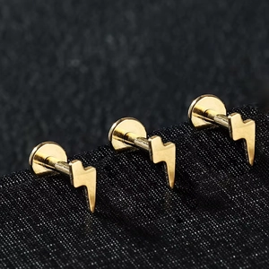 Three pieces of golden lightning bolt F136 titanium threaded studs for body piercing