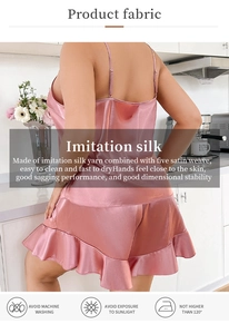 Detailed close-up of pink imitation silk fabric with elegant drape and ruffle trim details