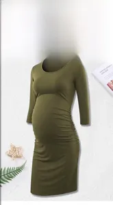 Detail of olive green maternity dress with side ruching and elastic knitted fabric
