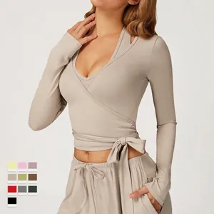 Women's chic beige wrap yoga set with long sleeves and cross tie-front waist sport top