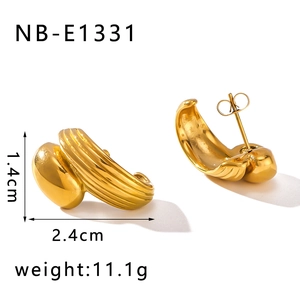 Detail view of C-shaped threaded earrings in gold finish with dimensions 1.4cm by 2.4cm