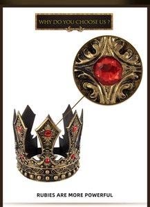 Detailed view of vintage bronze royal crown with red rubies and intricate floral patterns