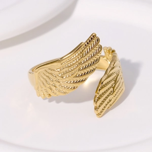 Polished golden stainless steel angel wing open ring with detailed feather texture