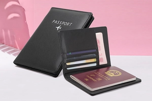 Detailed interior of black leather RFID passport holder with card slots and travel pockets