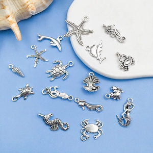 Detailed macro view of Tibetan silver ocean charms including starfish and seahorses for DIY