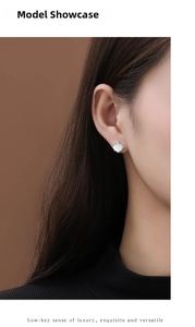 Macro detail of S925 silver ginkgo leaf earring with white mother of pearl and diamond