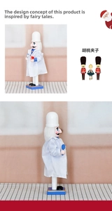 Detail of wooden doctor nutcracker holding a red tooth model and medical tool