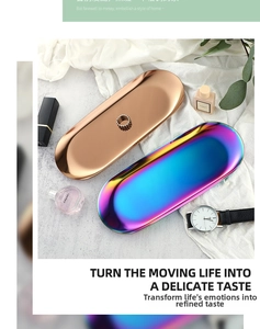 Polished stainless steel oval tray in rose gold and rainbow finishes on white fabric