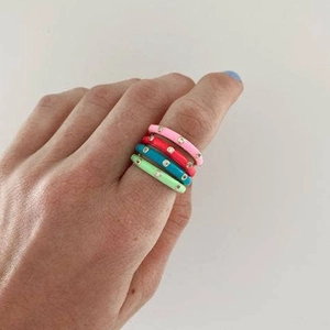 Adjustable gold rings with colorful enamel and zircon stones worn on finger