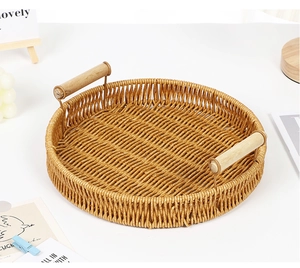 Top view of round woven fruit tray with wooden handles in a cozy home setting