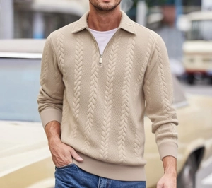 Detail of men's beige cable knit half-zip sweater showing the texture and zipper