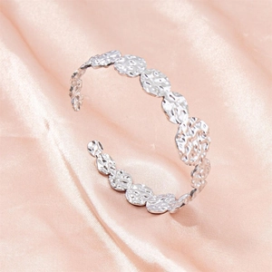 Adjustable silver C-shaped stainless steel cuff bracelet with hammered metal disc texture