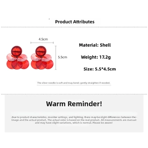 Detailed view of red tiered shell earrings measuring 5.5cm by 4.5cm and weighing 17.2g