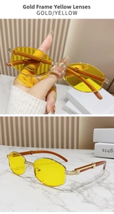 Nahaufnahme der goldenen Metallsonnenbrille mit gelben Gläsern und Holzmaserung