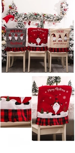 Close-up of Christmas gnome chair covers with red plaid ruffles and festive embroidery