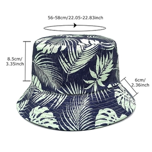 Reversible tropical bucket hat with blue palm leaf print and size measurements